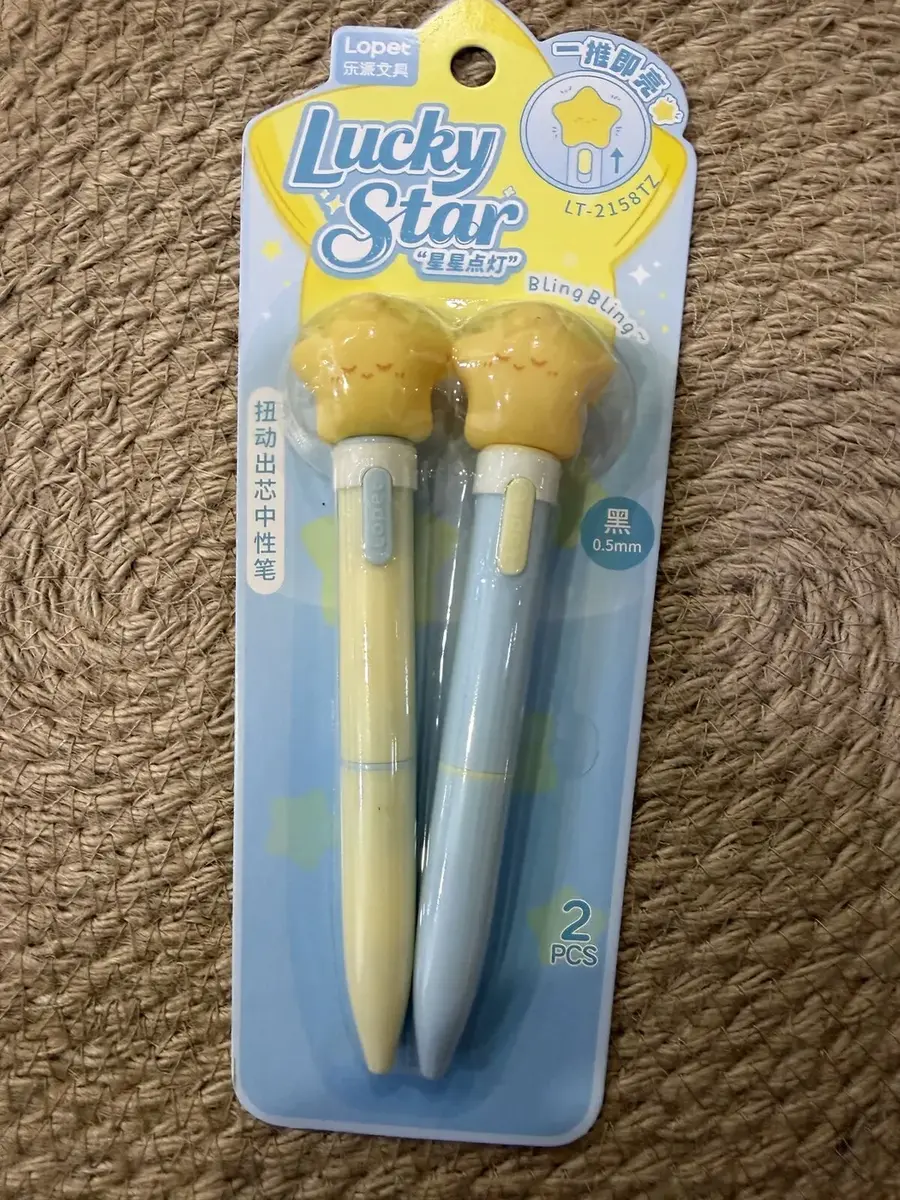 Two Lucky Star pens on a card.