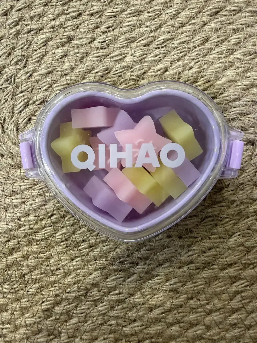 A heart-shaped box of pastel star erasers.